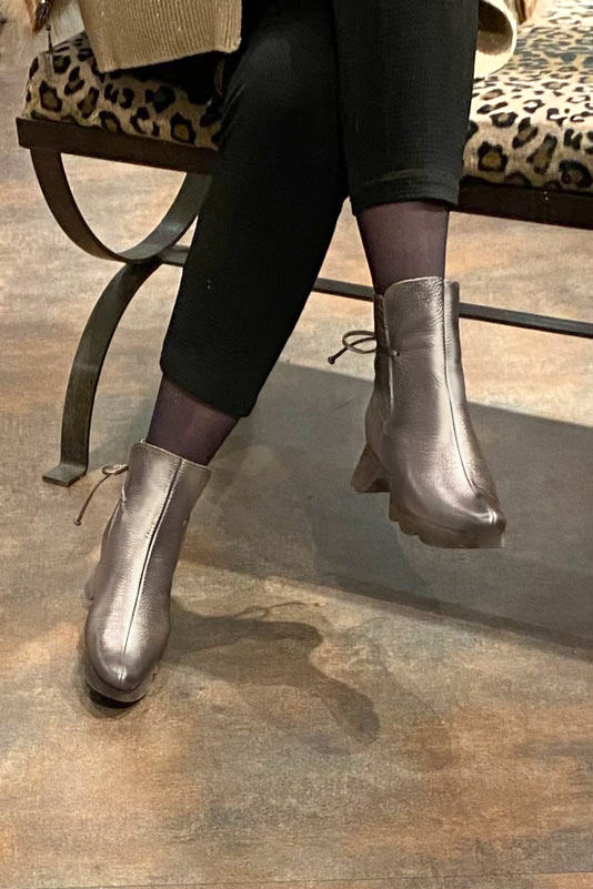 Bronze gold women's ankle boots with laces at the back. Round toe. Low rubber soles. Worn view - Florence KOOIJMAN